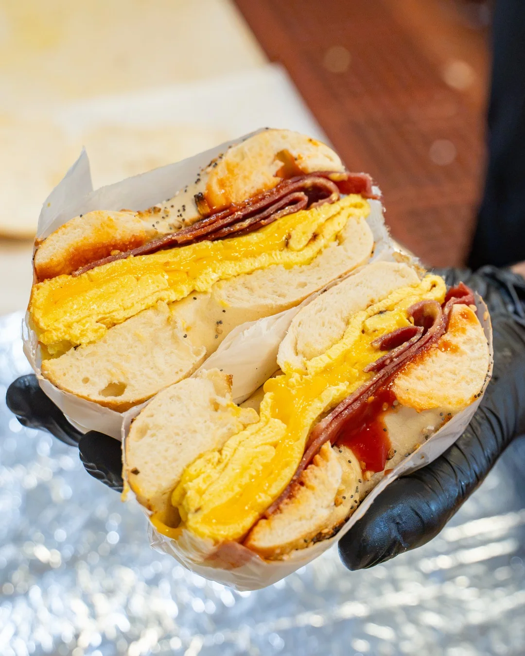 Bacon, egg and melted cheese on a fresh bagel